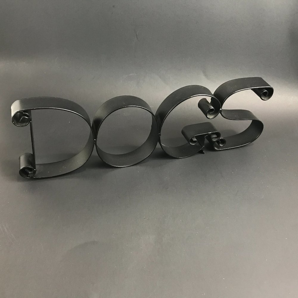 Black metal "Dogs" sign